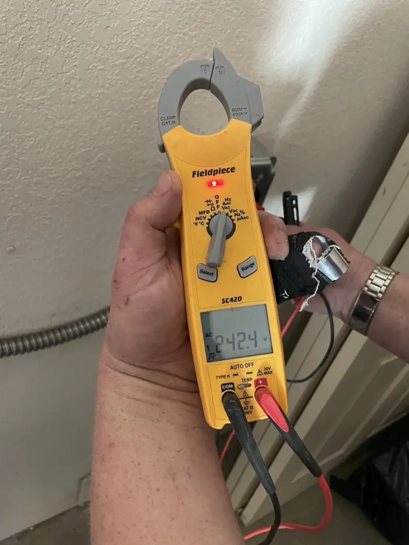 Voltage testing with clamp meter during Electrical Installation Services in Milford